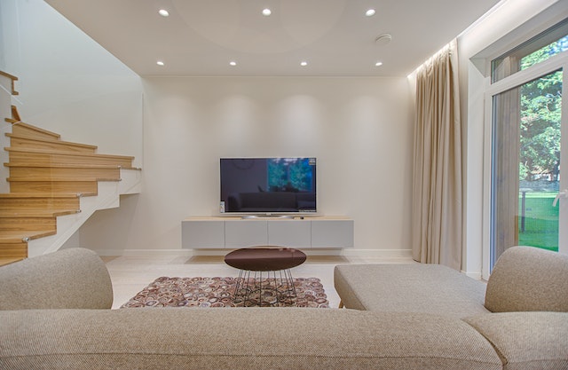beige living room with tv