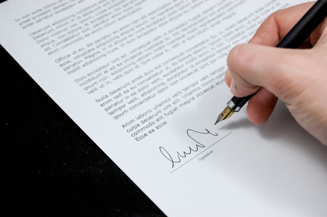person signing a lease agreement